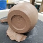 Raw Clay Cylinder on its side showing Signature